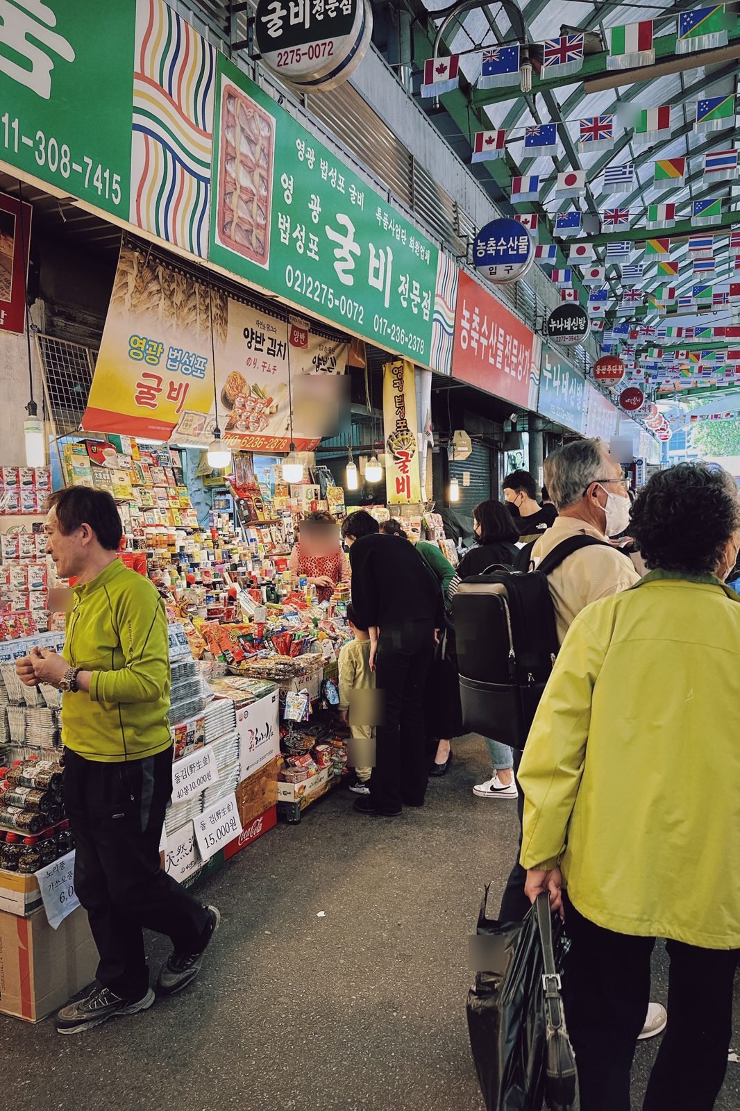 Shoppers walking the lanes of Gwangjang Market
