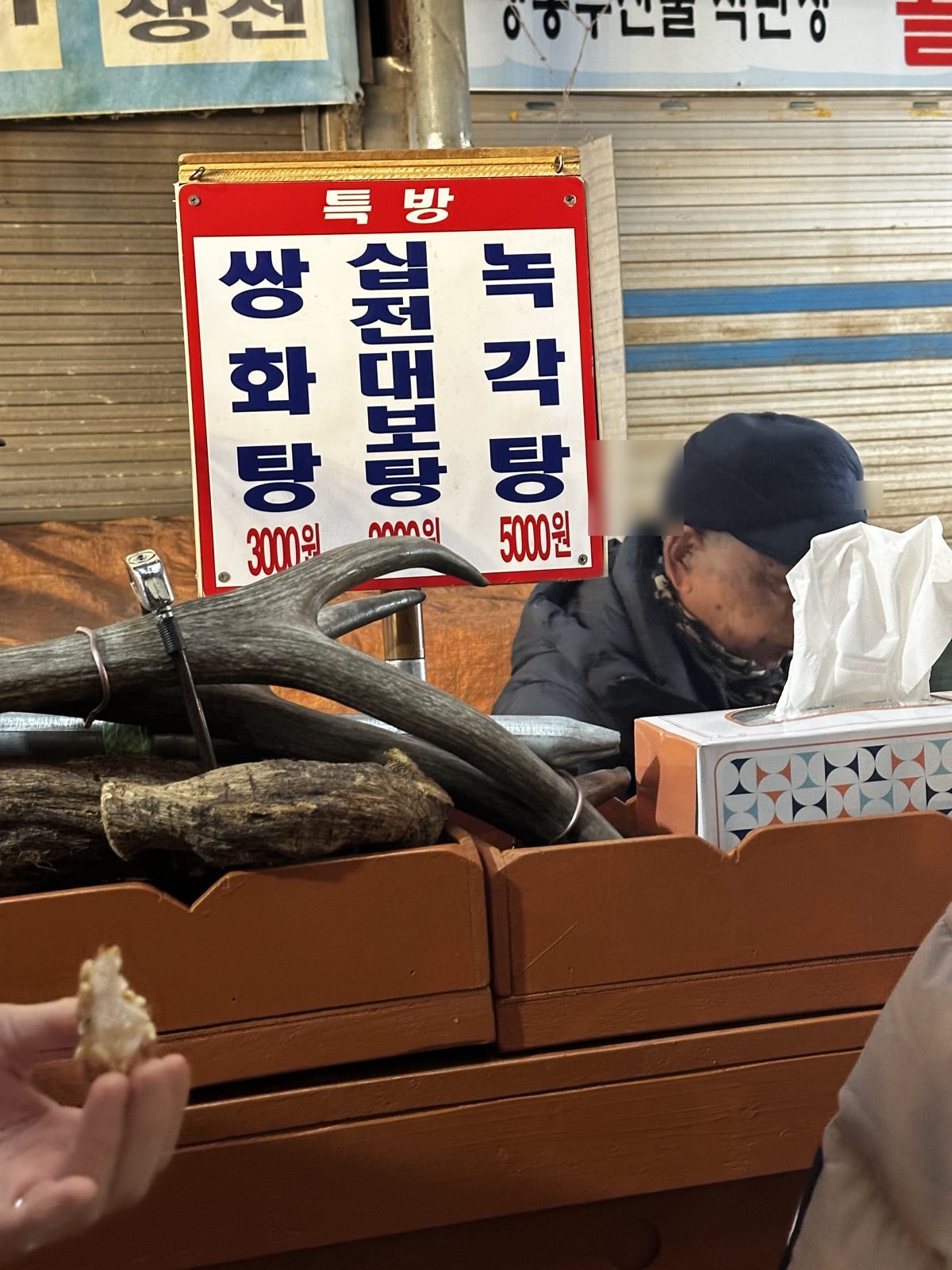 A Gwangjang Market shop with its menu posted on the wall