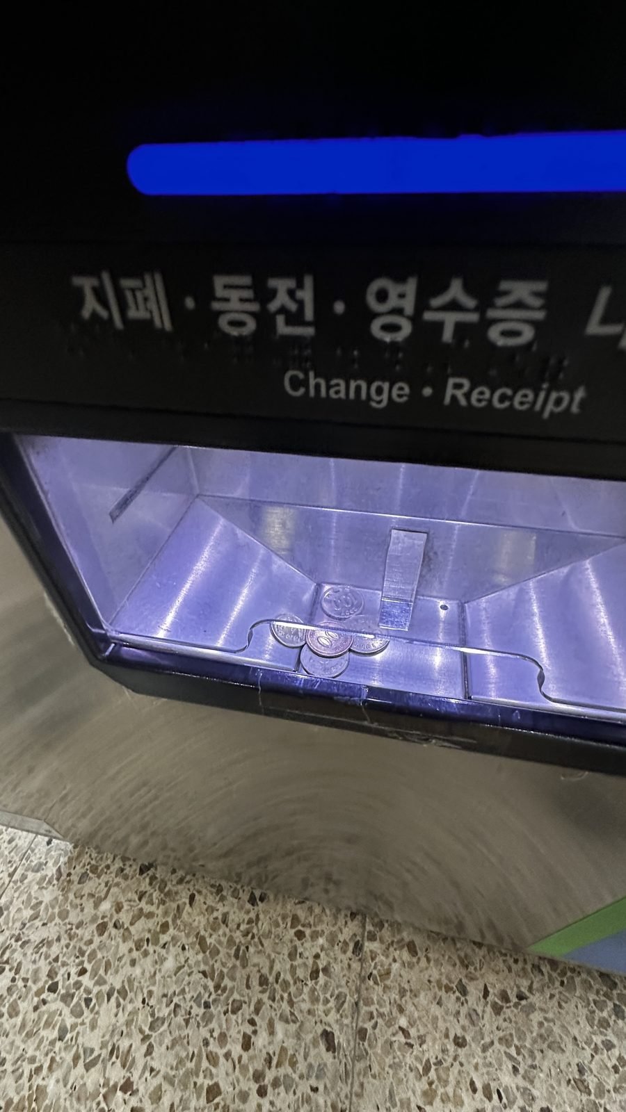 Bill, coin and receipt slots on a Seoul subway ticket machine